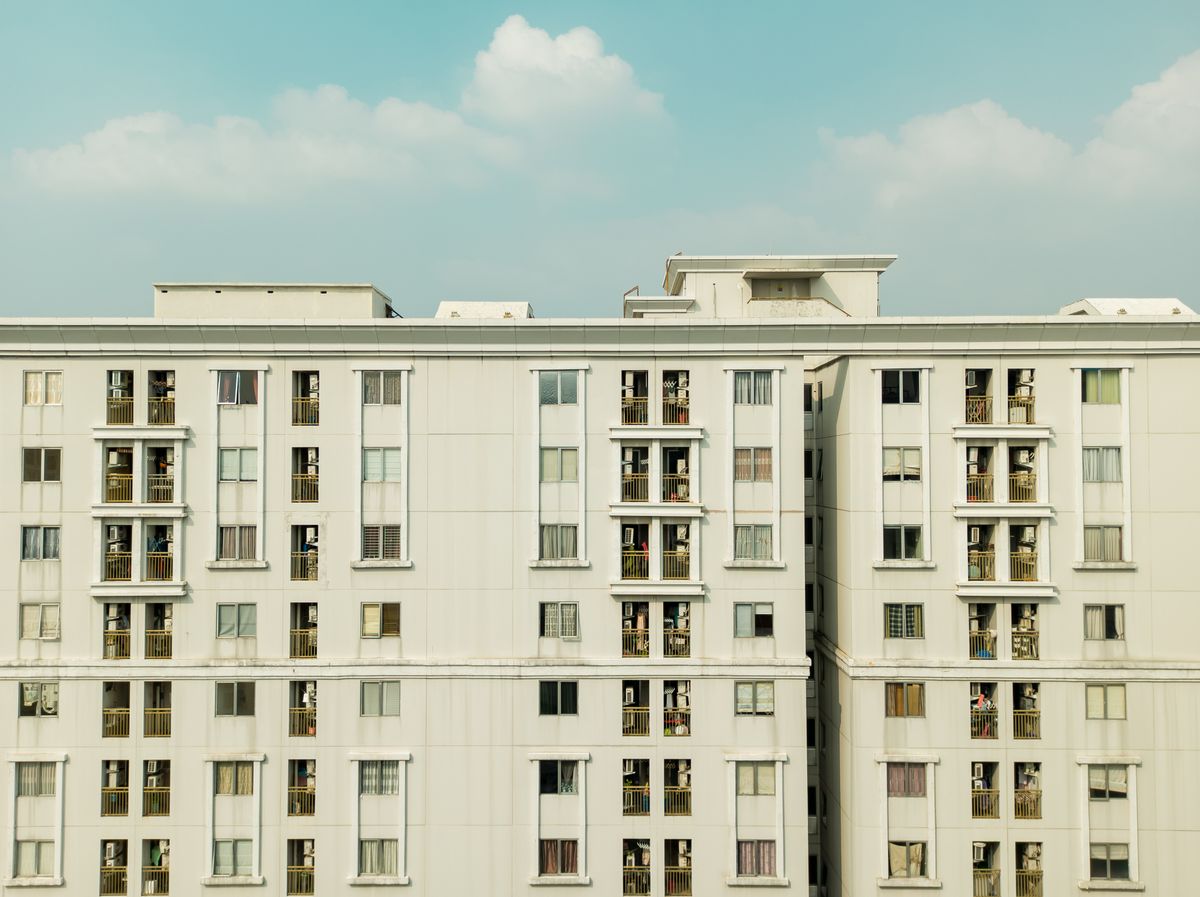 Exterior of a multi-tower apartment building, the kind of housing society eeVote runs elections for